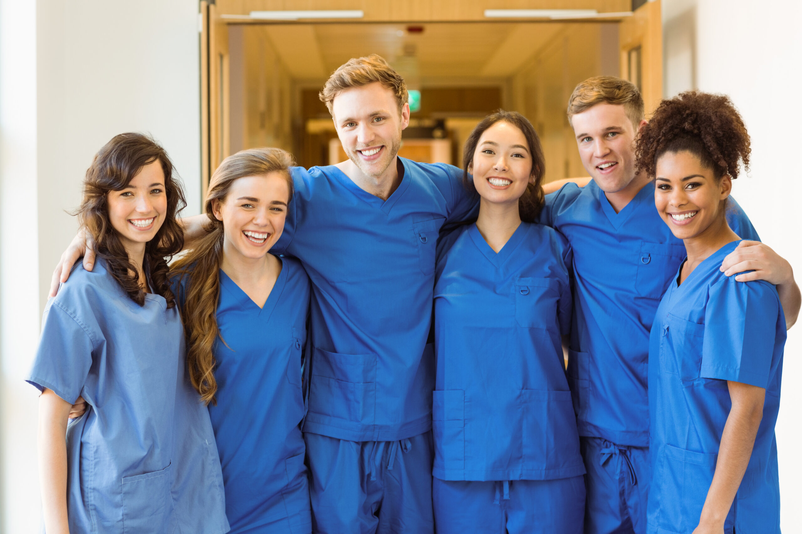 Medical students smiling at the camera at the university